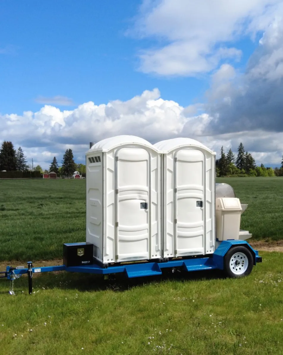 PT-10 Toilet Trailer towed by a UTV across rugged terrain
